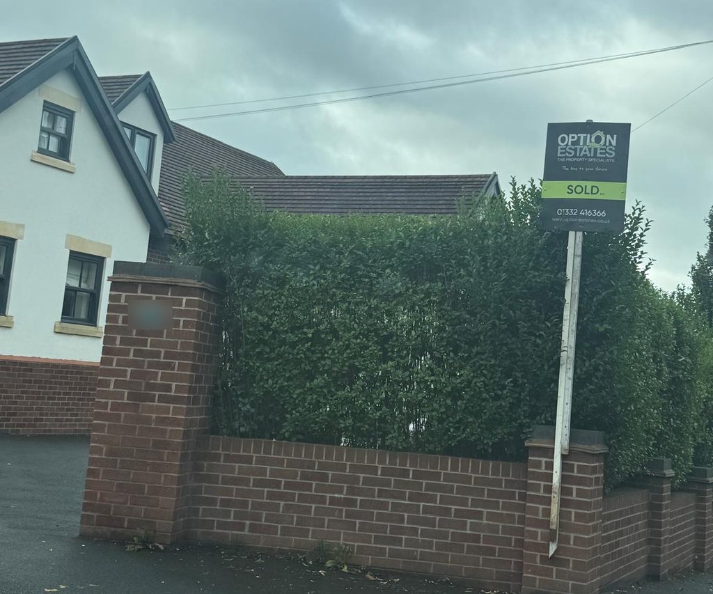 An Option Estates sold board outside a home on Pastures Hill, Littleover